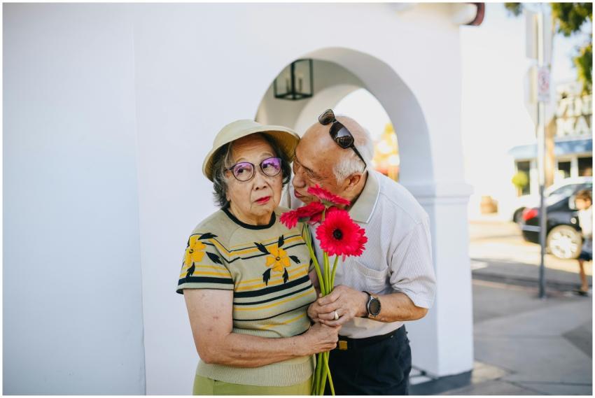 A senior Asian couple enjoying a tender moment wit