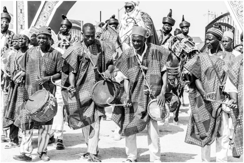 Group of African men in traditional attire perform