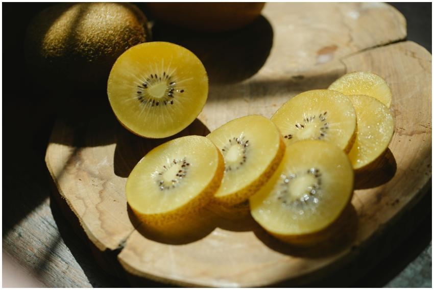 From above of fresh healthy sliced kiwi placed on