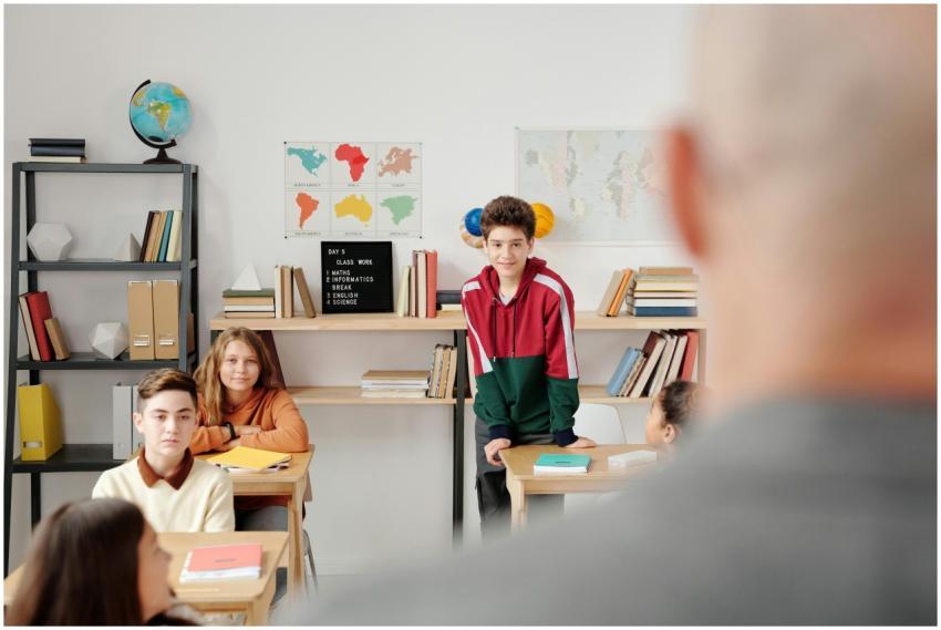 Students attentively listening in a classroom envi