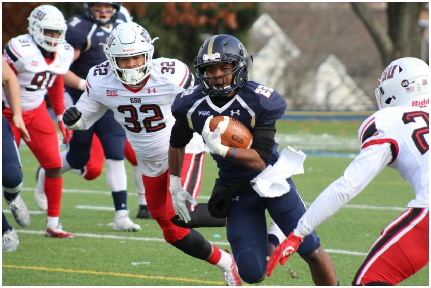 Dynamic college football match with players in act