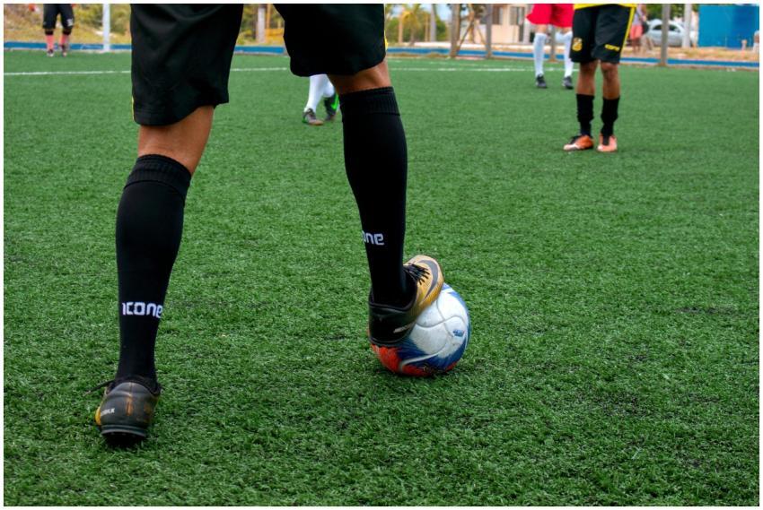 Close-up of a soccer player controlling the ball d