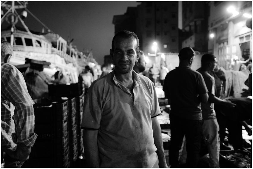 Nighttime street photo capturing local life in Ras