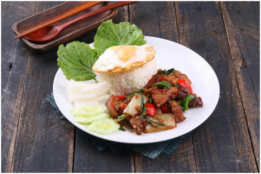 Appetizing Thai dish with stir-fried meat, rice, a