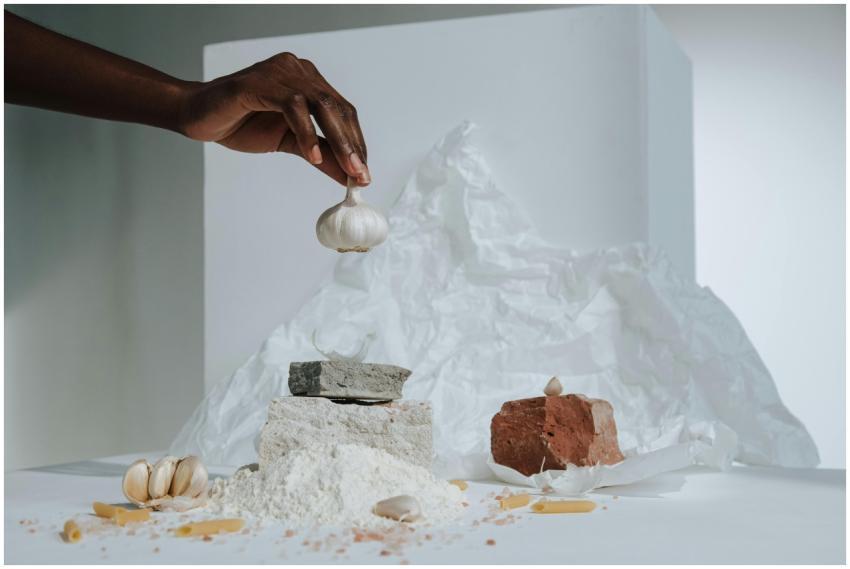 Artistic composition featuring a hand arranging ga