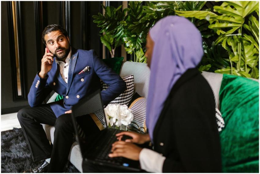 Two colleagues engaged in a business meeting indoo