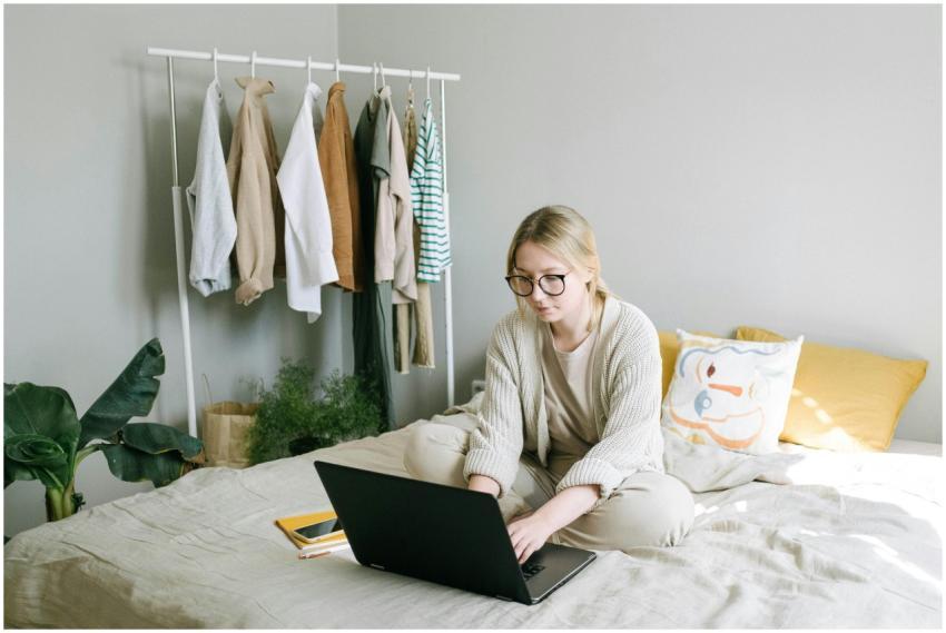 Caucasian woman with eyeglasses working on laptop
