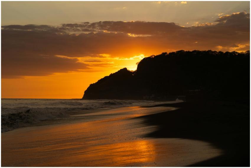 A breathtaking sunset over a tranquil beach in El