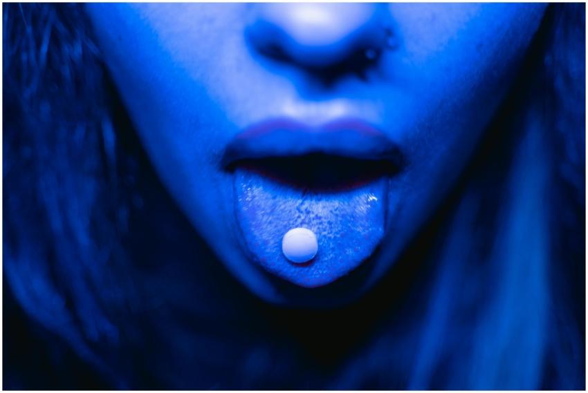 Dramatic close-up of a person with a tablet on the