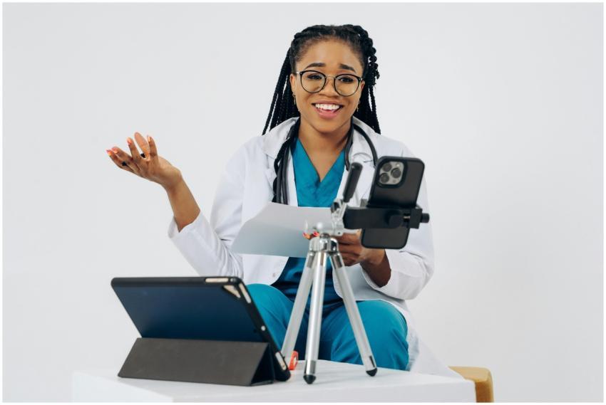 Black female doctor in virtual consultation, smili