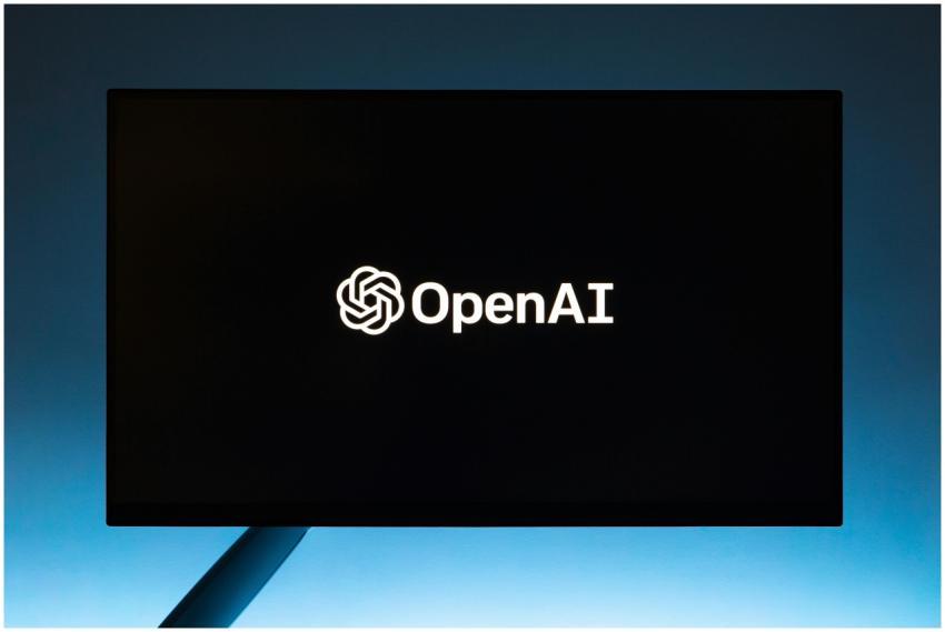 Minimalist display of OpenAI logo on a screen, set