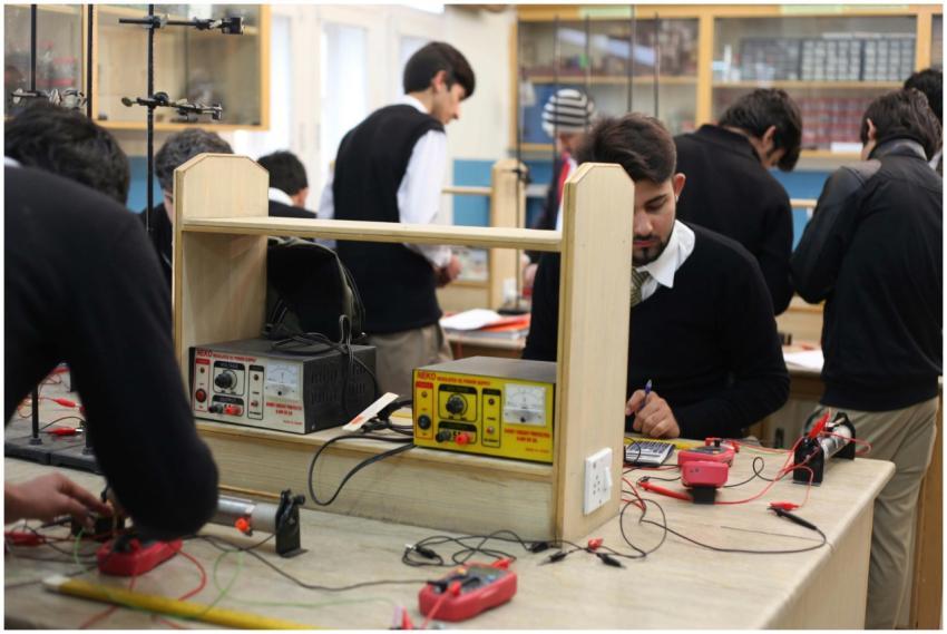 Students working on electronics projects in a lab,