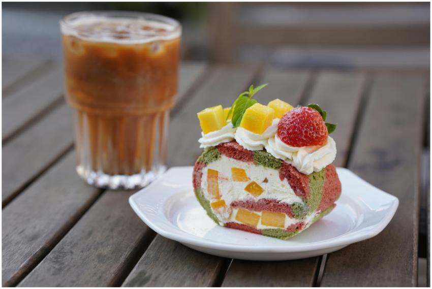 Delicious fruit-filled Swiss roll with iced coffee