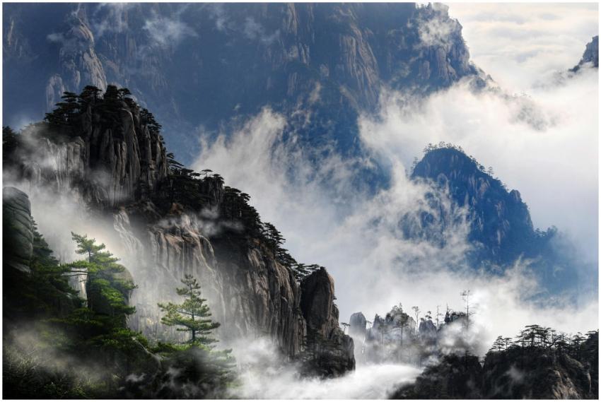 Misty mountain peaks of Huangshan, China enveloped