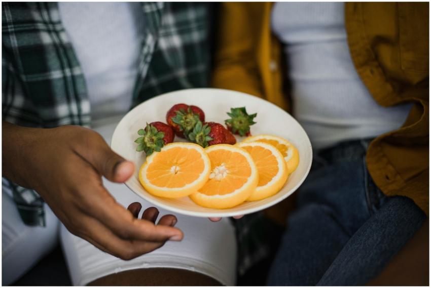 Vibrant plate of sliced oranges and fresh strawber