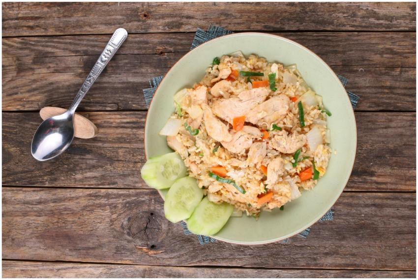 Top view of chicken fried rice with vegetables on