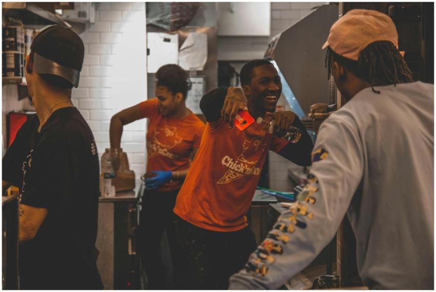 Energetic restaurant staff working together in a k