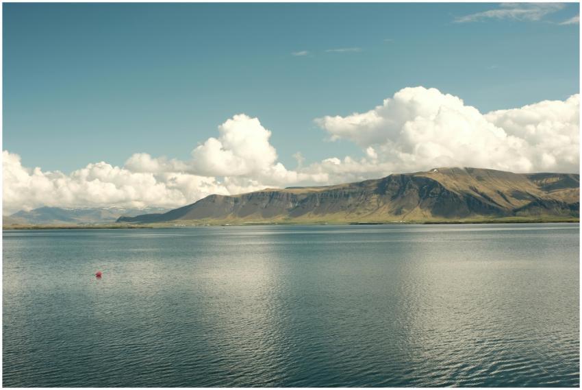 Breathtaking view of Mount Esja with clouds over o