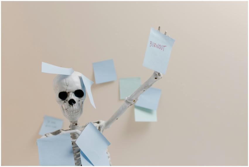 Humorous depiction of burnout with a skeleton hold