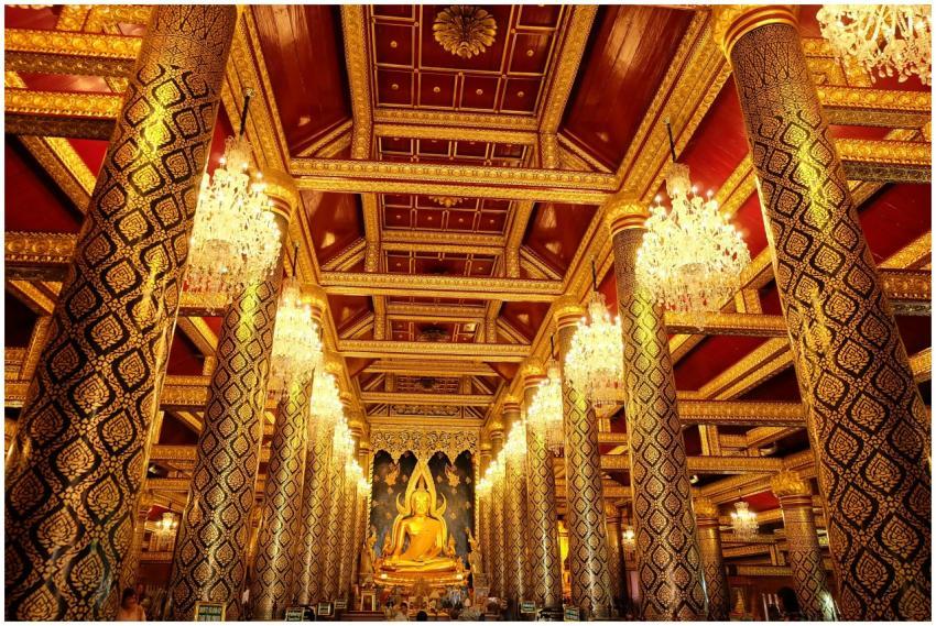 Stunning interior of an ornate Buddhist temple wit