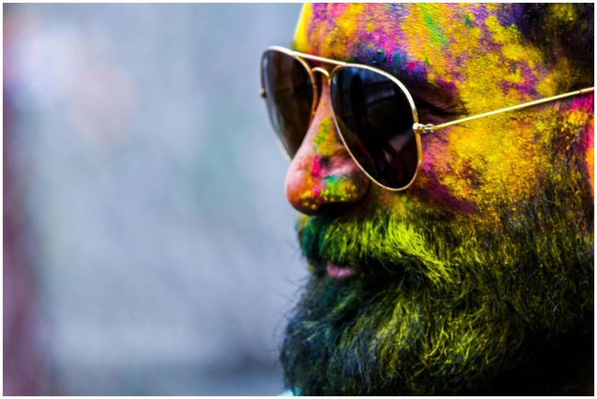 Vibrant close-up of a man with sunglasses covered