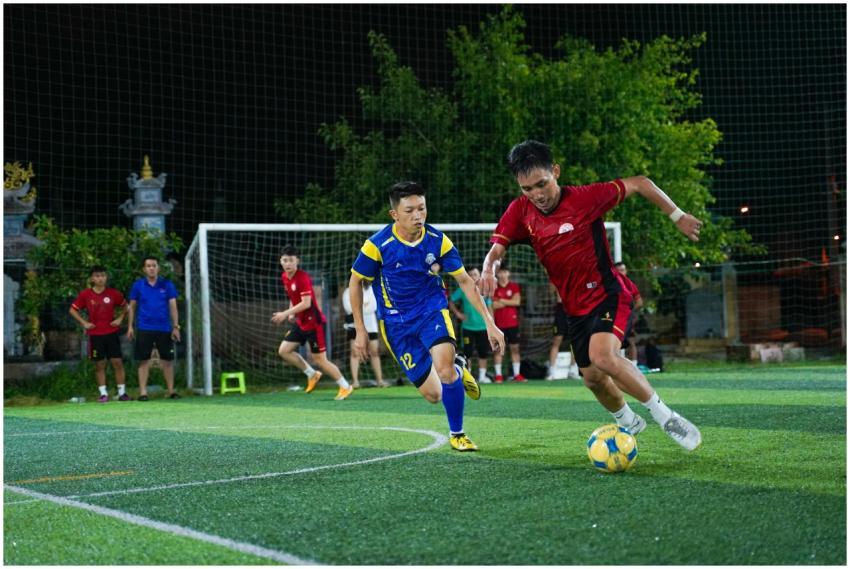 Dynamic shot of soccer players competing in a nigh