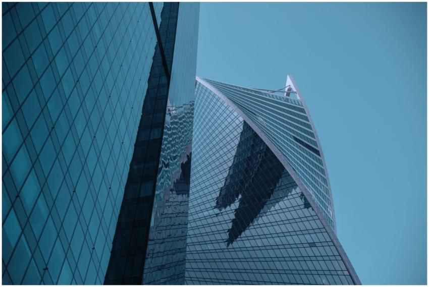 Modern skyscraper with glass facade and unique des