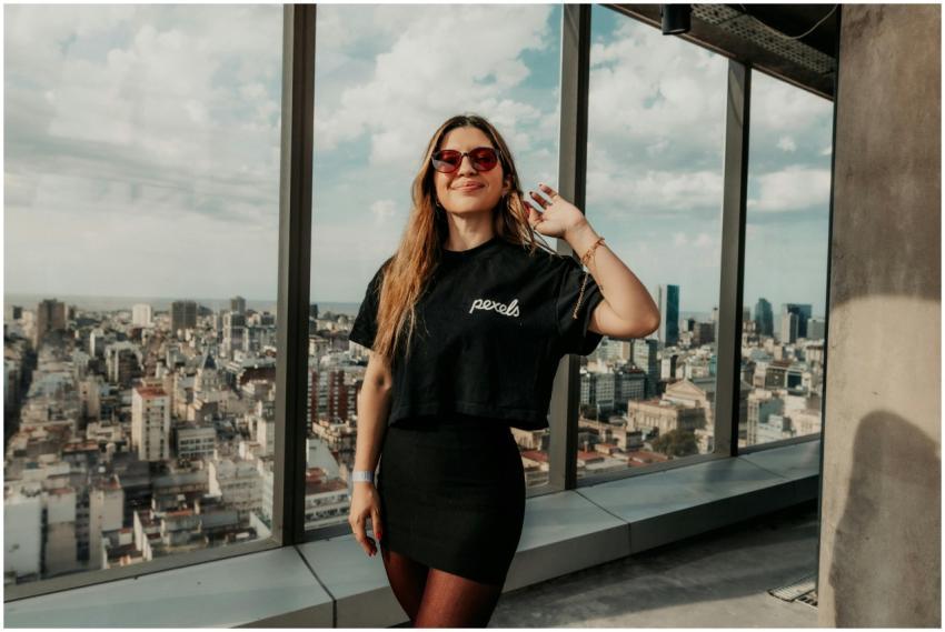 Stylish woman in sunglasses enjoys the view from a