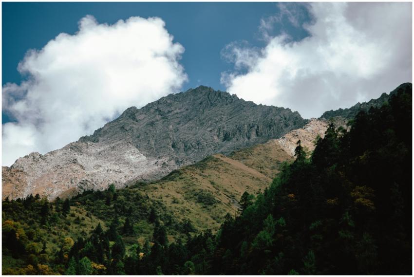 A breathtaking view of a mountain peak surrounded
