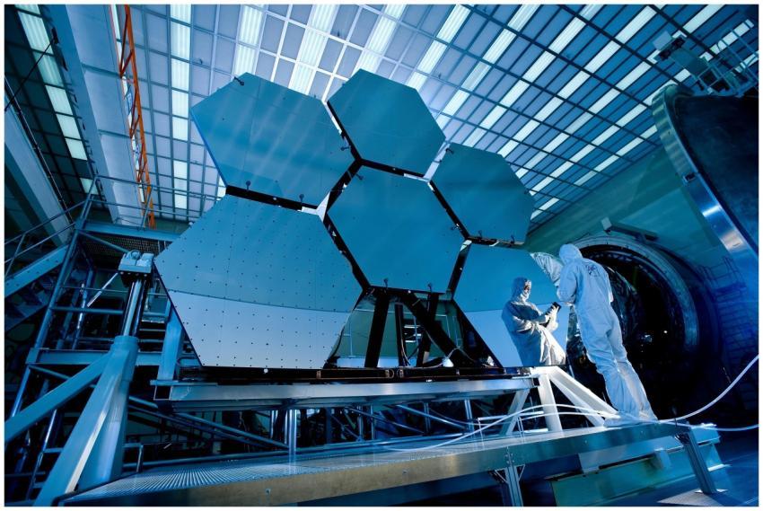 Engineers in protective suits work on telescopic m