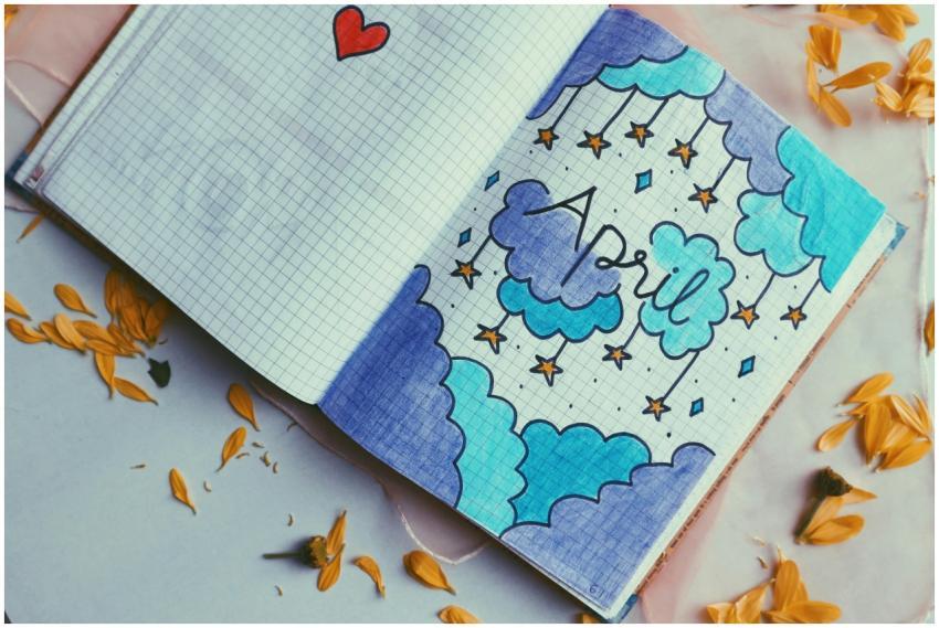 Artistic notebook page design featuring April them