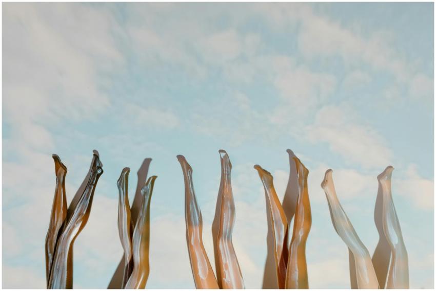 Creative display of mannequin legs reaching upward