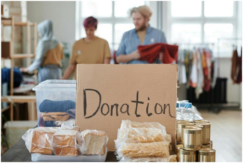 Volunteers sort clothes and food in a donation cen