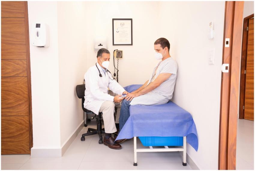 Doctor checking patient's vitals in a clinical set