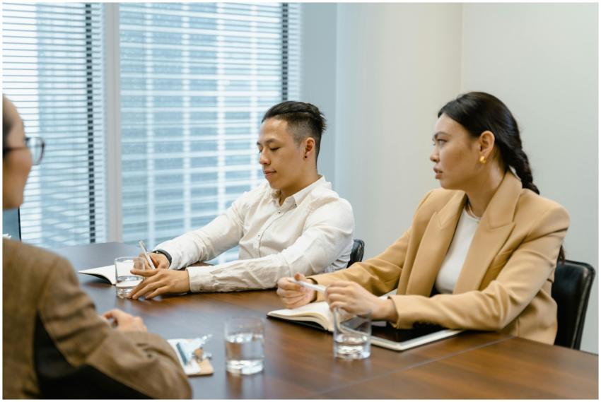 Business professionals in a meeting room discussin