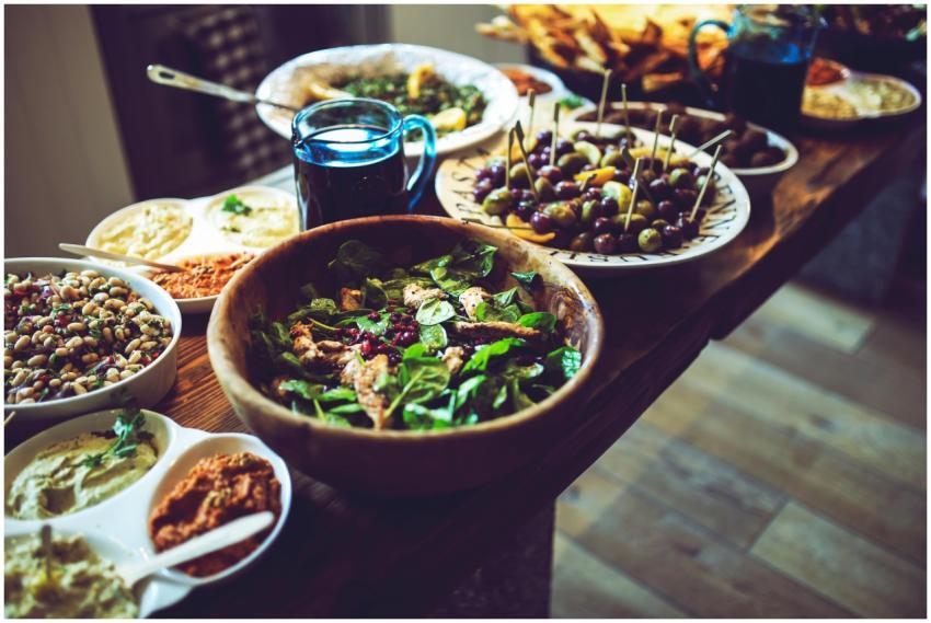 Mediterranean antipasti featuring olives, spinach