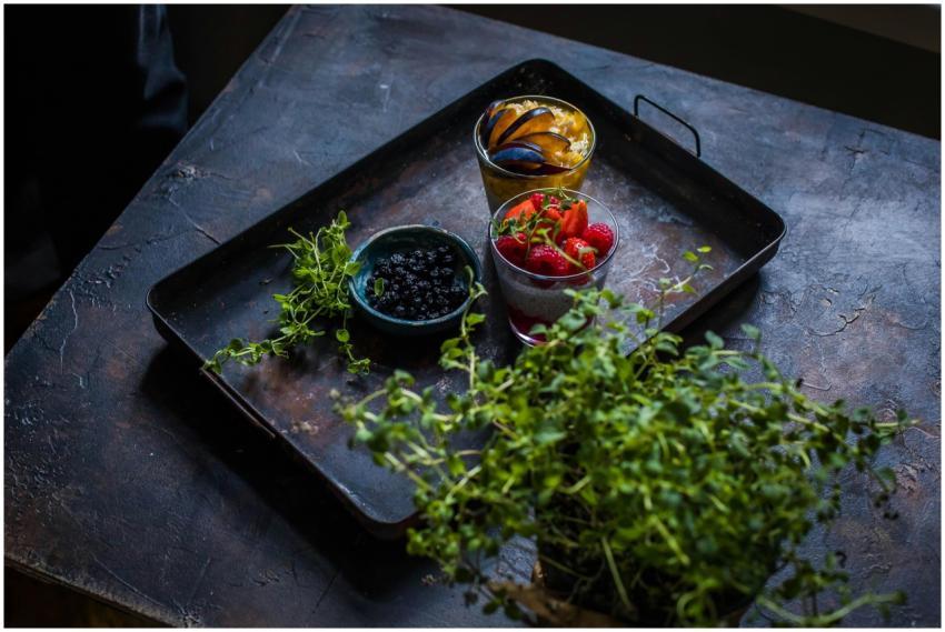 Fresh fruits with herbs on a rustic tray, perfect