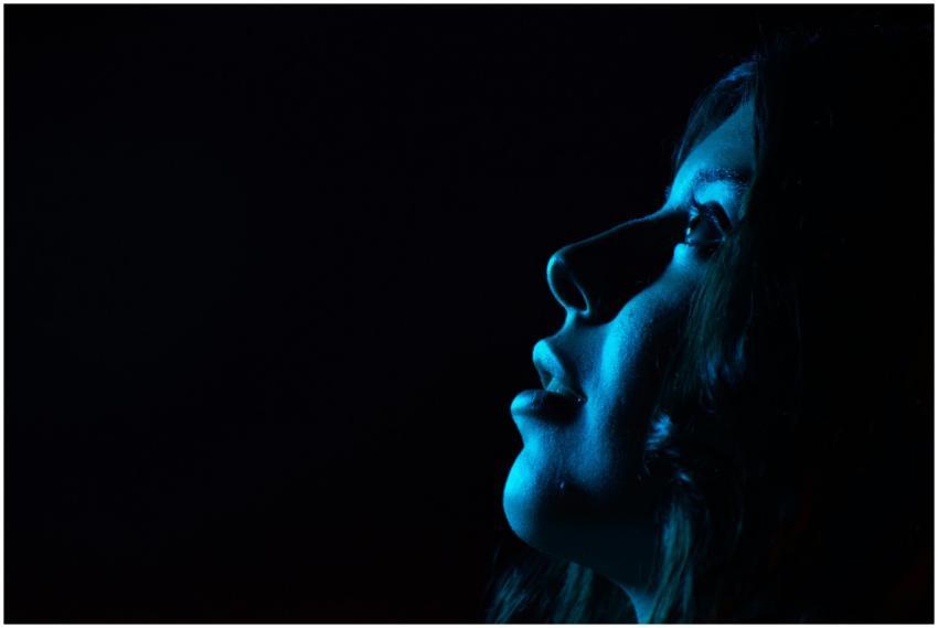 A striking portrait of a woman's side profile illu