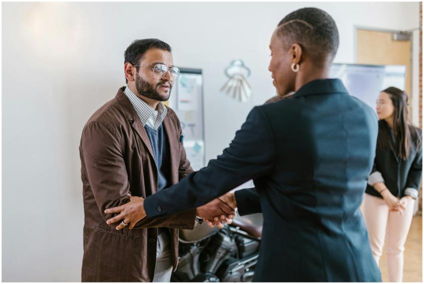 Business professionals greeting with a handshake i