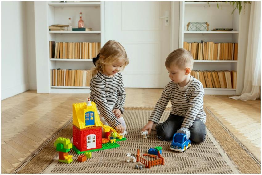 Two children enjoying playtime with colorful build
