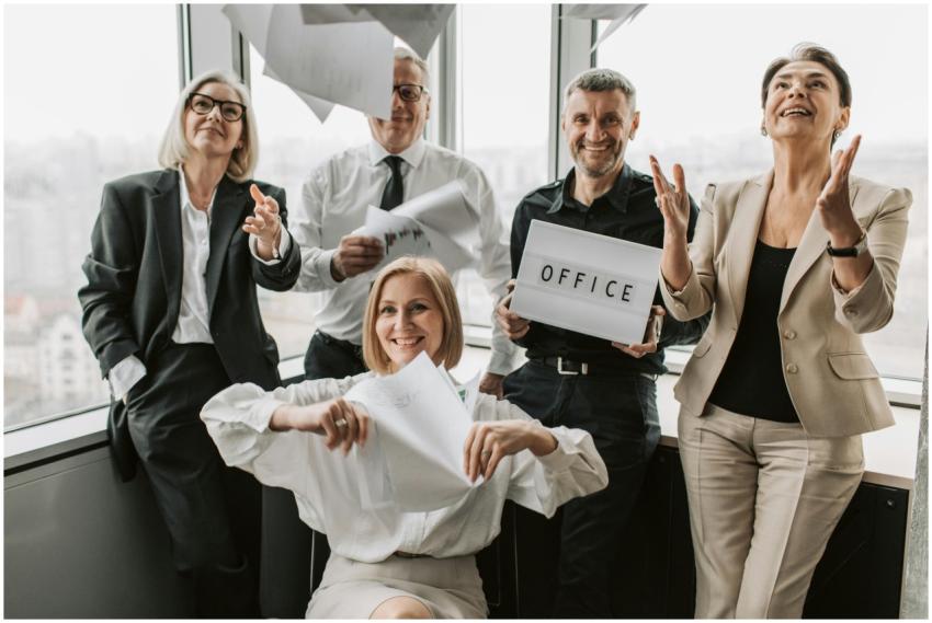 A diverse group of business professionals joyfully