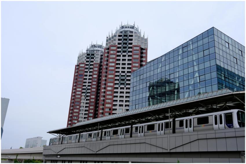 Capture of Tokyo skyline with metro passing modern