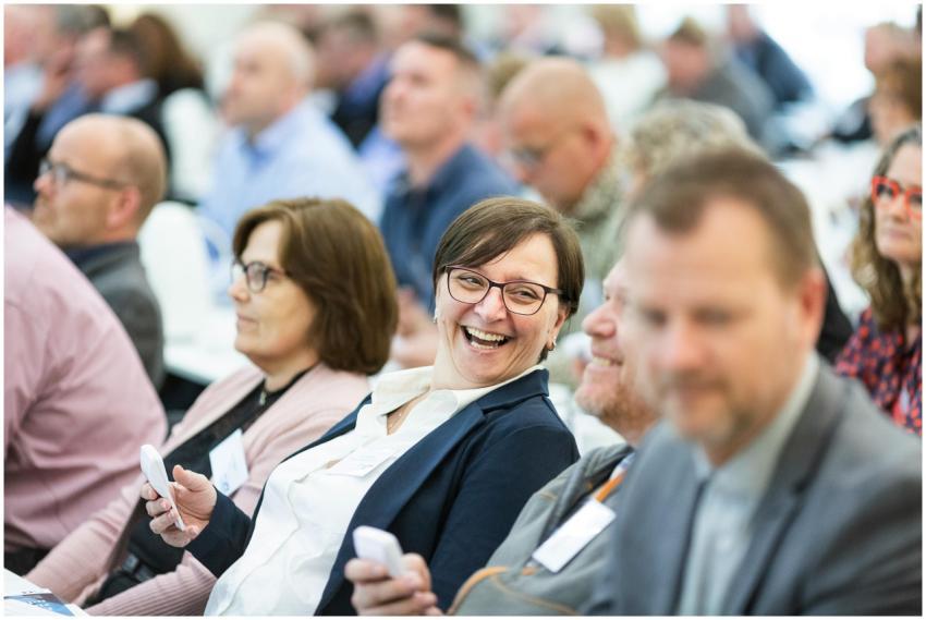 Group of diverse adults smiling and engaging durin