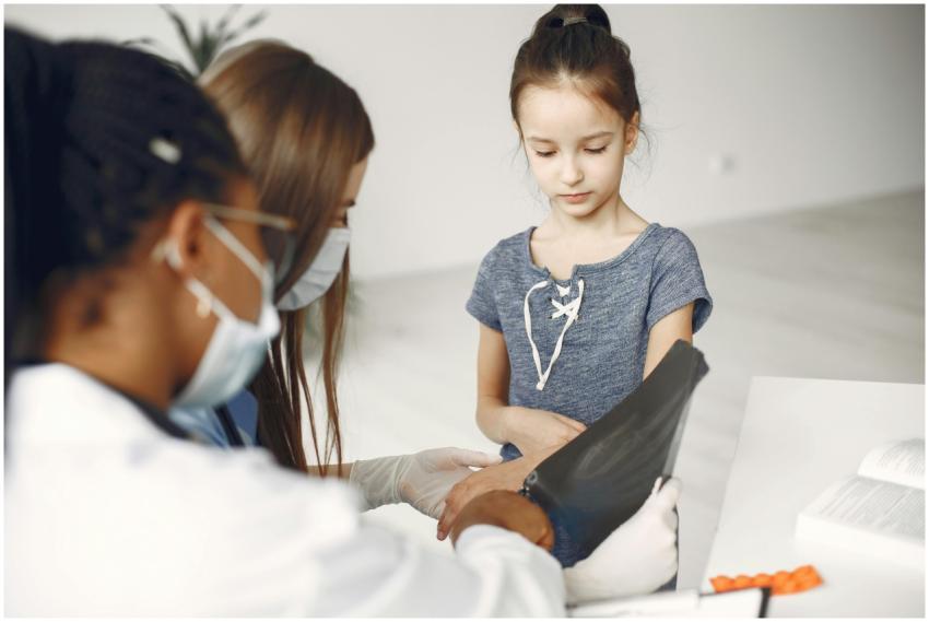 Young girl undergoing a medical checkup with docto