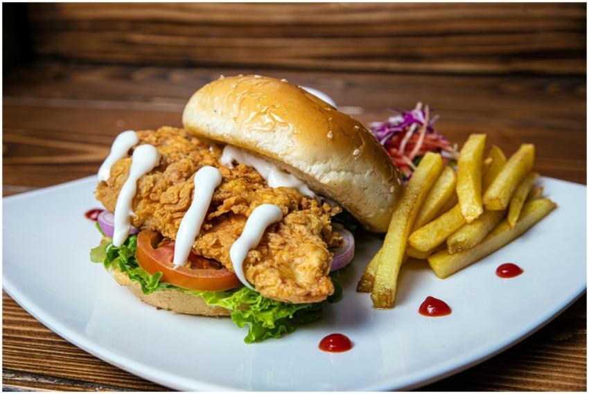Delicious crispy chicken sandwich with fries on a