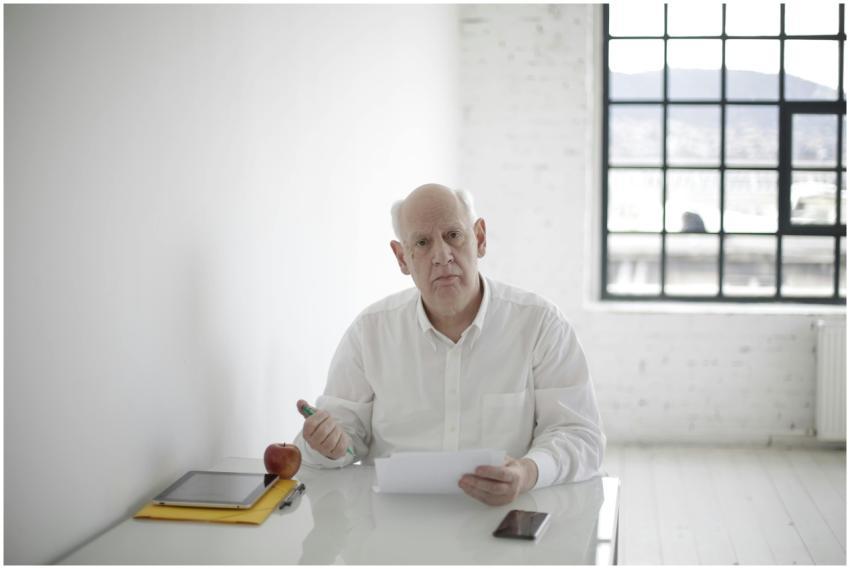 Mature businessman analyzing documents at a modern