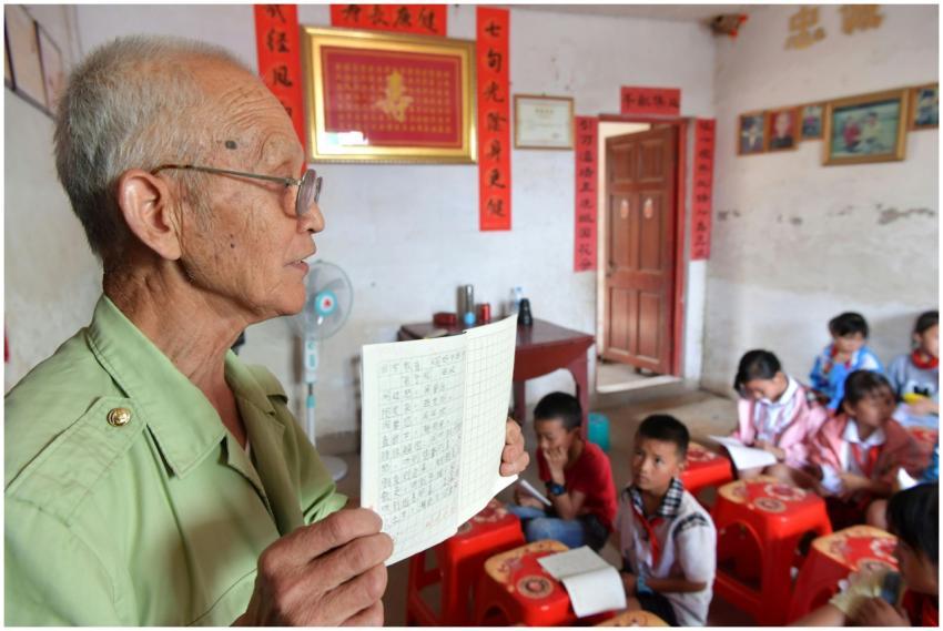 A teacher instructing students in an elementary cl