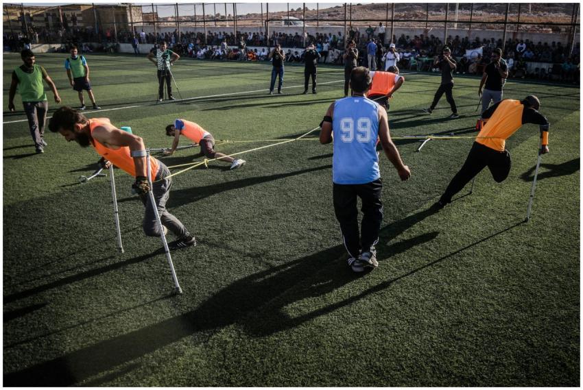 Disabled athletes competing in a team sport on a g