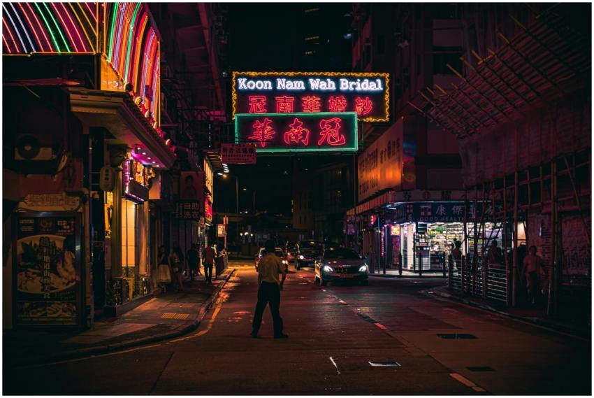 Neon-lit street view in Hong Kong at night showcas