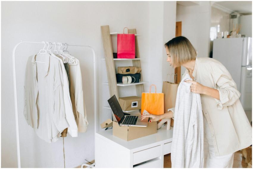 A woman in casual attire unpacking a delivery box
